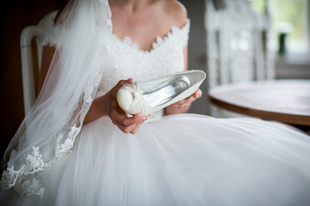 Lady In Wedding Dress Sitting Down